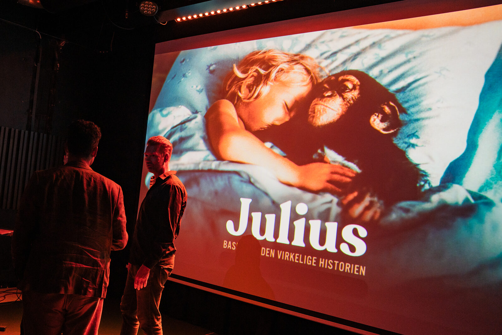 The poster for the film Julius on the screen during the talk