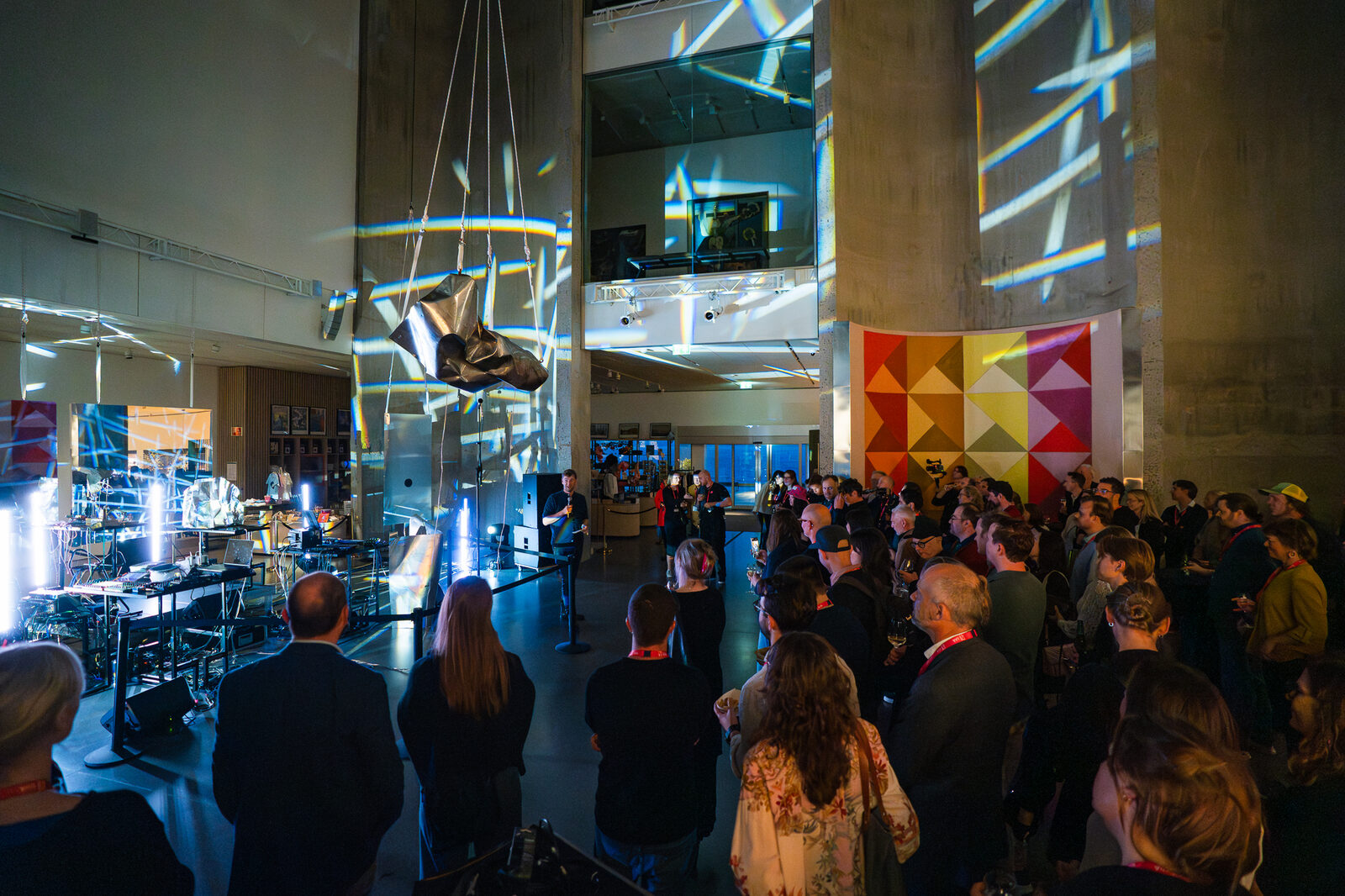 The audience gathered among the concrete silos before the performance