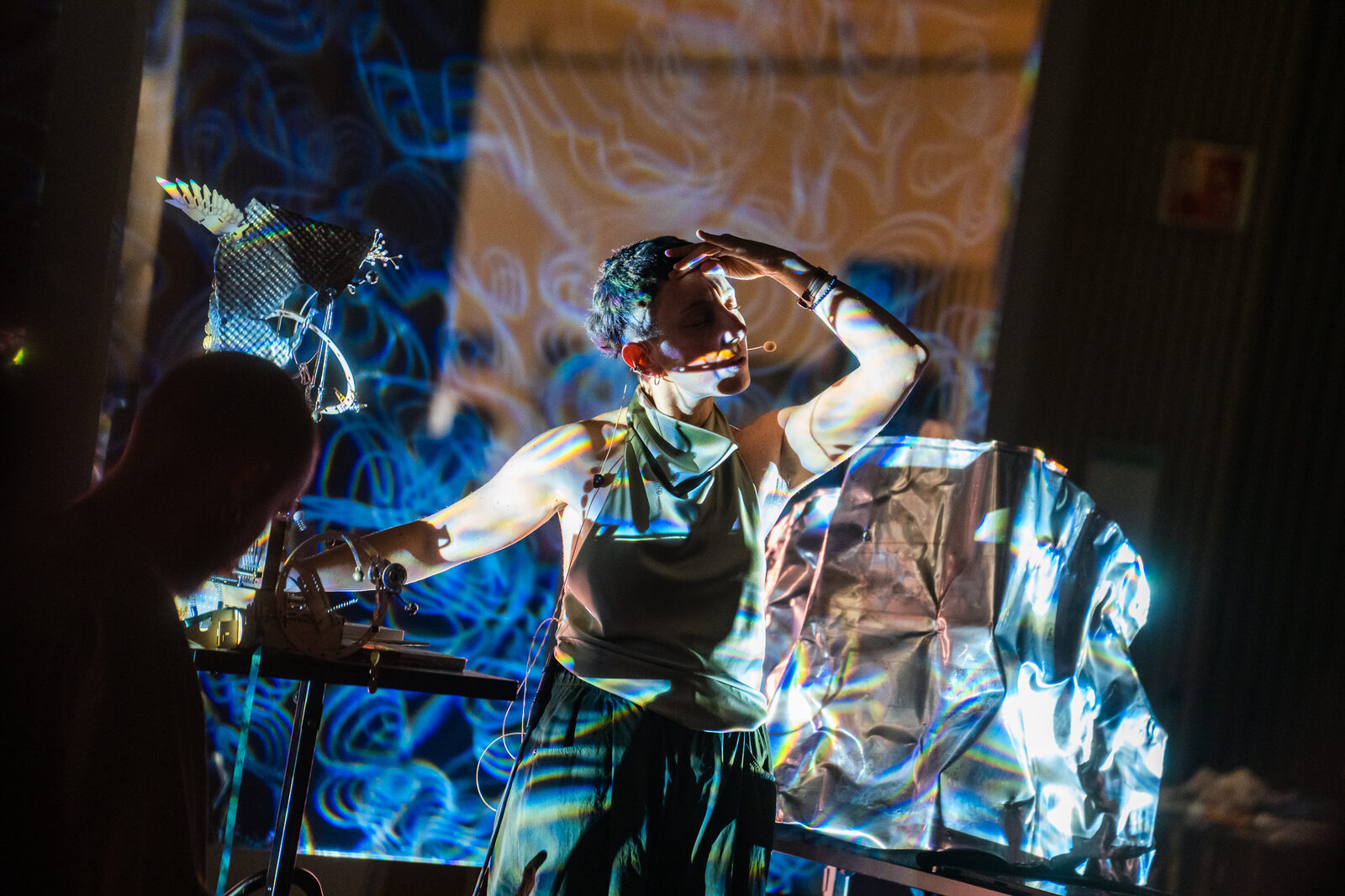 Alessandra Bossa performing .skin with steel membranes and projected light